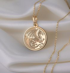 🐉 Step into the enchanting realm of Chinese New Year with our mesmerizing dragon necklace! 🎉 Crafted with meticulous attention to detail, this exquisite piece is a vibrant celebration of tradition, strength, and auspicious beginnings. Imagine the majestic dragon, intricately designed with shimmering scales ✨ and fierce claws, symbolizing power and resilience. With each wear, you'll embody the spirit of this mythical creature, carrying with you the energy of the Lunar New Year. 🌟 * Gender : Ma Sterling Silver Necklace With Dragon Design, Fantasy Brass Jewelry For Gifts, Gold Dragon Design Jewelry, Dragon Design Jewelry For Gift, Dragon Design Amulet Necklace, Round Dragon Design Jewelry For Gifts, Gold Jewelry With Dragon Design, Dragon Design Jewelry Gift, Round Dragon Design Necklace For Gift