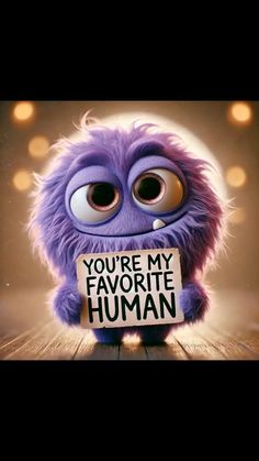 a purple monster holding a sign that says you're my favorite human