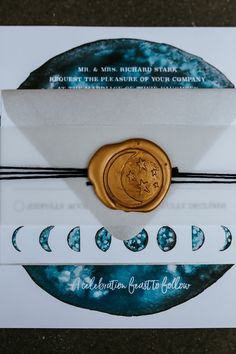 a wax seal is on top of a card with the words, moon and stars