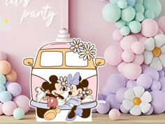 an image of mickey and minnie mouse on the back of a vw camper