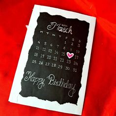 a happy birthday card with a chalkboard calendar for each month on it and a heart in the middle