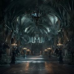 an empty cathedral with chandeliers hanging from the ceiling and lights shining down on the floor