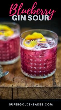 two glasses filled with blueberry gin sour