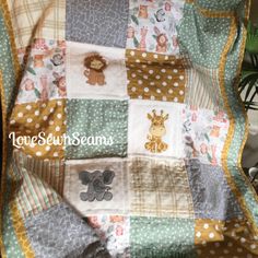 a baby blanket with animals and polka dots on it