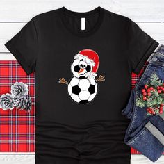 "Christmas Soccer Ball Shirt, Christmas Snowman Soccer Santa Shirt, Soccer Player Christmas Shirt, Soccer Lovers Christmas Holiday Season Tee WELCOME TO \"BesTeeShirts\" ! High quality and super soft, comfortable shirt. Made with top of the line vinyl and pressed with a professional grade heat press. All our simple color ones like White, Black, and Red are 100% Cotton. All our Heathered Colors are cotton/polyester blend and they are super comfy soft! SIZING AND COLORS Make sure you check our siz Soccer Christmas Shirts, Balls Shirt, Santa Shirts, Simple Colors, Soccer Ball, Soccer Players, Christmas Snowman, Christmas Shirts, Mens T