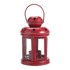 a red lantern with stars on the top and one candle in it's holder