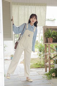 Classic high rise overalls with an embroidered bib featuring a cycling bear with flowers, side pockets and back pockets. Cut open button holes with scissors. S: 34.5" waist, 41.5" hips, 24.5" thighs, 18" ankles, 24" inseamM: 36" waist, 43" hips, 25.5" thighs, 18.5" ankles, 24" inseamL: 37.5" waist, 44.5" hips, 26.5" thighs, 19" ankles, 24" inseam How to attach buckles:Slide the rectangular buckle on first, followed by the T-shaped buckle. Overall straps will hold on its own as such or you can sl White Casual Bib Front Overalls, White Bib Front Overalls With Pockets, Style White Overalls, White Overalls Outfit, Bear With Flowers, Overalls White, White Overalls, Button Holes, Shoe Gifts