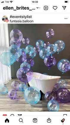 a bathtub filled with lots of bubble balloons