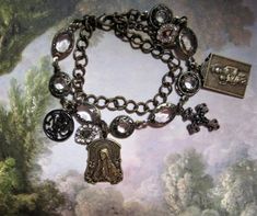 The Virgin Mary charm bracelet features beautiful one- of a kind brass, vintage-style charms showcasing the Virgin Mary and inscribed in French " Je suis l'immaculee conception" which in French translates to " I am the immaculate conception". The Immaculate Conception, Immaculate Conception, The Virgin Mary, Beautiful One, Virgin Mary, Vintage Style, Beauty Book, Jewelry Bracelets, Charm Bracelet