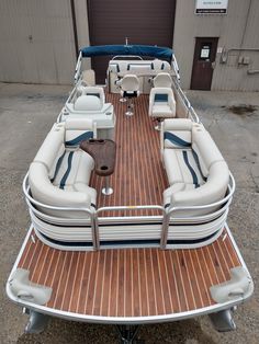 the inside of a pontoon boat parked in a lot