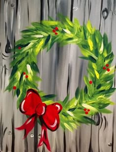 an image of a christmas wreath painted on wood