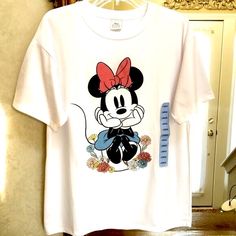 New Minnie Mouse Short Sleeve T Shirt. Size L. Minnie With Sparkly Flowers. Disney. Cute White Minnie Mouse Tops, Cute White Minnie Mouse Top, White Minnie Mouse Graphic Tee, White Mickey Mouse T-shirt, Short Sleeve Minnie Mouse T-shirt For Spring, Playful White Minnie Mouse T-shirt, Spring Cotton T-shirt With Minnie Mouse, Black Minnie Mouse T-shirt Short Sleeve, Mickey Mouse Shorts