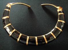 "Fabulous Yellow Gold Tone Metal With Black Color Gloss Enamel Sleek Double Rigid Hinged Collar Necklace Geometric Ethnic Gothic Style Design Fashion Jewelry  The flexible hinged ends opening for ease of dress. Measures approximately 15\" to 17\" long by 1\" wide (at the widest point). This fabulous necklace is in very good vintage condition with very little signs of wear due to its age, overall this beautiful piece is clean and ready to wear!.  The necklace is signed China with trademark symbol Luxury Black Enamel Wedding Jewelry, Luxury Classic Black Enamel Necklace, Gothic Style Fashion, Trademark Symbol, Gold Bag, Bib Necklaces, Brass Necklace, Gothic Style, Creative Jewelry