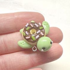 there is a small green turtle with chocolate frosting on it's shell