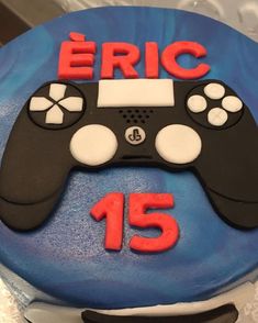 a birthday cake with a video game controller on it's side that says eric 15