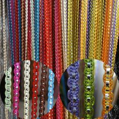 there are many different colored beads on display