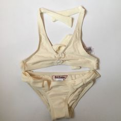 Super Cute Ivory Juicy Couture Bikini -This Swim Suit Was Never Used But Has No Tags, Its In Perfect Condition -Size 2 -Little Flower Details On The Top And Bottom Add To A Bundle And Save $$$ Juicy Couture Swimsuit, Couture Swimsuit, Theodore Nott, Swim Suits, Kids Swimming, Swim Suit, Bathing Suit, Juicy Couture, Tankini