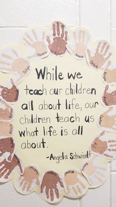 a sign that says while we teach our children all about life, our children teach us what life is all about