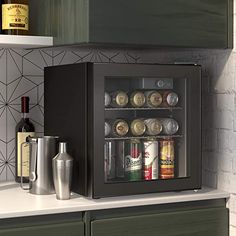 an open mini fridge sitting on top of a kitchen counter next to a bottle opener