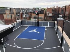 an indoor basketball court in the middle of a city