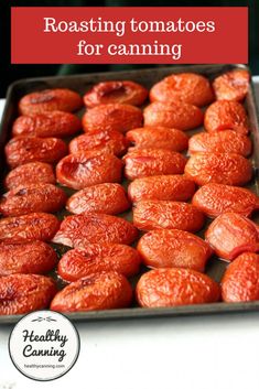 roasted tomatoes in a baking pan with text overlay reading roasting tomatoes for canning