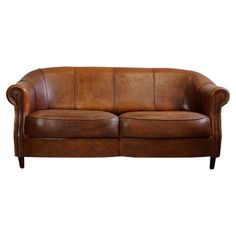 a brown leather couch on a white background