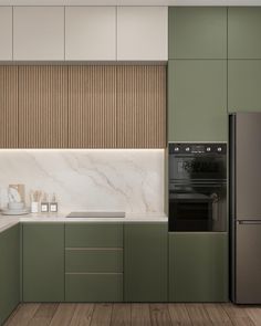 a modern kitchen with green cabinets and marble counter tops, along with stainless steel appliances