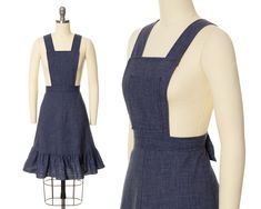 "♡ PLEASE ENLARGE PHOTOS FOR MORE DETAIL ♡ D E T A I L S * 1970s pinafore skirt * lightweight blue denim in a cotton (50%) - polyester (50%) blend * bib front * wide straps attach via buttons on back waist (two length settings) * fitted natural waist * a-line shape * ruffled tier at hem * nylon back zipper + button closure * unlined * label: size/content tag present M E A S U R E M E N T S fits like a: small bust: free bib width: 7.75\" (at top) bib length: 8.75\" waist: 27/27.5\" hips: free skirt length: 22.5\" skirt sweep: 49\" (just above ruffled tier) C O N D I T I O N Excellent vintage condition. No issues to note! Freshly cleaned and ready to wear! ➳ Please read store policies prior to purchase. Thank you!! xoxo, Allyson ♥ Visit the shop! http://www.birthdaylifevintage.etsy.com ♥ Fol Pinafore Skirt, Prairie Dress, Overall Dress, Denim Overalls, Wide Straps, Small Bust, Vintage 1970s, A Line Skirt, Skirt Length