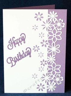 a white and purple birthday card with flowers on it