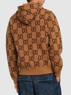 Non-detachable hood. Ribbed cuffs and hem. All over pattern placement may vary. One front kangaroo pocket. Model is wearing a sizeS All Over Pattern, Sport Swimwear, Pocket Model, Sports Sweatshirts, Crossbody Messenger Bag, Knit Hoodie, Sports Brands, Detachable Hood, Shearling Jacket