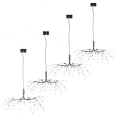 three lamps are connected to each other in the shape of four poles with small dots on them