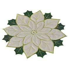 a white flower with green leaves is shown on a white background and has gold trimmings