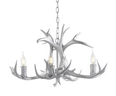 a chandelier with antlers hanging from it's center and two candles in the middle