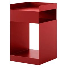 a red cube shaped shelf with one section open