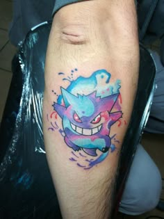 a person with a tattoo on their leg that has an image of a cartoon character painted on it