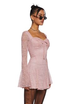 Get those points with this mini dress that is fully lined, has a floral lace overlay,a padded bust,a sweetheart neckline, a decorative bow on the front, sheer long sleeves with flared cuffs, and a lettuce trim. Y2k Pink Dress, Girl Scout Costume, Grunge Dresses, Spain Fits, Dolls Kill Outfits, Dress With Flared Sleeves, Coquette Clothes, Costume Boots, Birthday Sweet 16