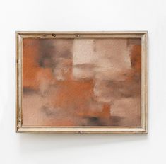 an abstract painting hanging on the wall