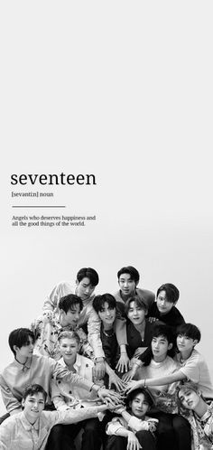 a group of people sitting next to each other in front of a white wall with the words seventeen on it