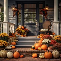 a front porch filled with lots of pumpkins and gourds