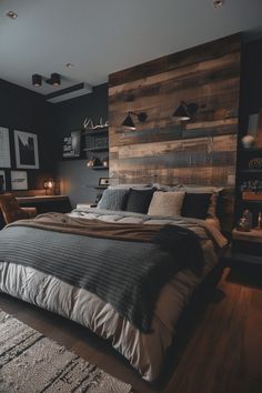 a large bed sitting in the middle of a bedroom next to a wooden headboard