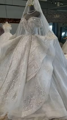 a wedding dress on display in a store