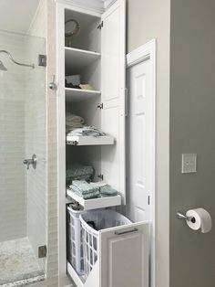 an open closet with towels and other items in it