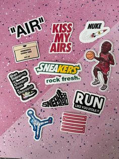 various stickers on the back of a pink suitcase