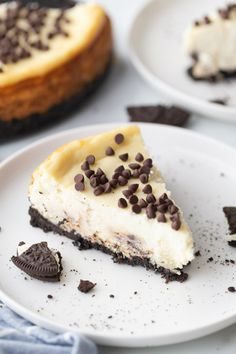 a slice of oreo cookie cheesecake on a plate with an oreo cookie