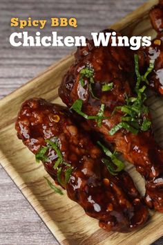 the chicken wings are covered in sauce and garnished with parsley