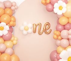 balloons are arranged around the word me in gold and white letters on a pink background