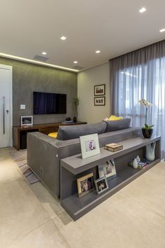 a living room filled with furniture and a flat screen tv