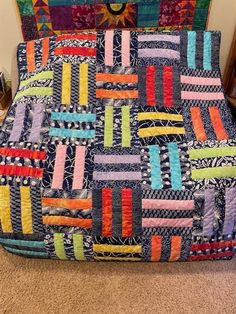 a quilted chair sitting on top of a carpet covered floor