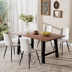 a dining room table with white chairs and a bowl of fruit on the wooden table