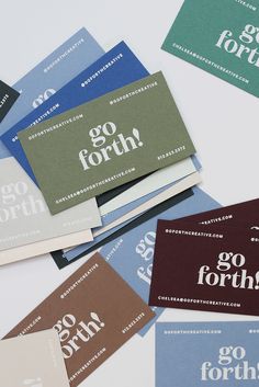 several business cards with the words go forth printed on them, all in different colors